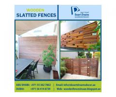 Wood Slatted Panels Installing in Uae | Natural Wood Finish Fence | Villa Privacy Fence Dubai.