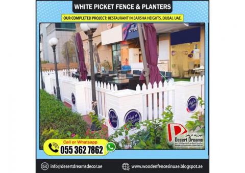 Restaurant Seating Privacy Fences | White Picket Fence and Planters | Dubai | Abu Dhabi.